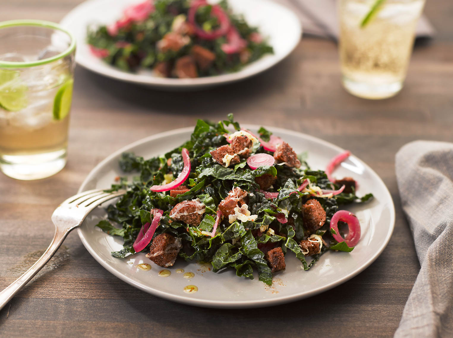 KaleSaladwithCarawaySeedVinaigrettePickledRedOnionsandGruyereCheeseCroutons1290